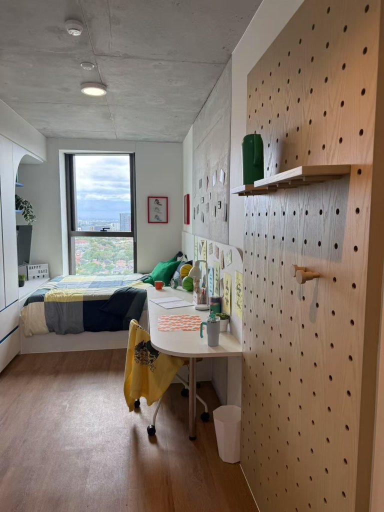 Custom bedroom wardrobe in a student apartment in Sydney with a modern design and open storage.