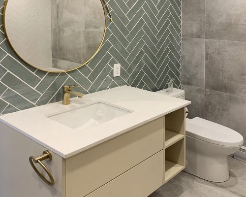 Canada Luxury Apartment Decoration 1 Modern bathroom vanity with gold faucet and round mirror in Canada Luxury apartment whole house custom project