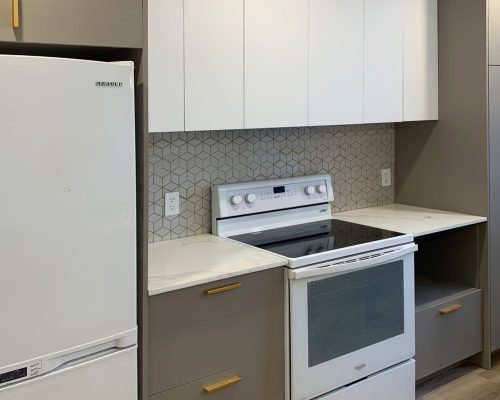 Canada Luxury Apartment Decoration 3 Contemporary two-tone kitchen cabinets with geometric backsplash and minimalist handles
