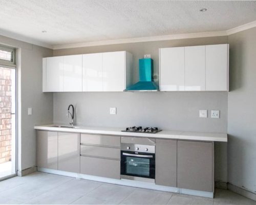 48 Sets Custom Cabinets for Ongwe Holiday Apartment Decoration in Namibia 5 Ongwe Apartment kitchen cabinets with ample storage space and a modern design.