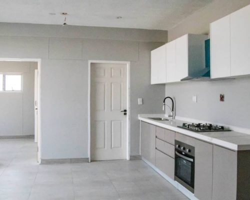 48 Sets Custom Cabinets for Ongwe Holiday Apartment Decoration in Namibia 7 Organized kitchen cabinets with efficient space utilization in Ongwe holiday apartment decoration project.