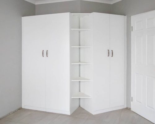 48 Sets Custom Cabinets for Ongwe Holiday Apartment Decoration in Namibia 9 Interior of custom wardrobe with shelves and hanging space in Ongwe holiday apartment decoration project.