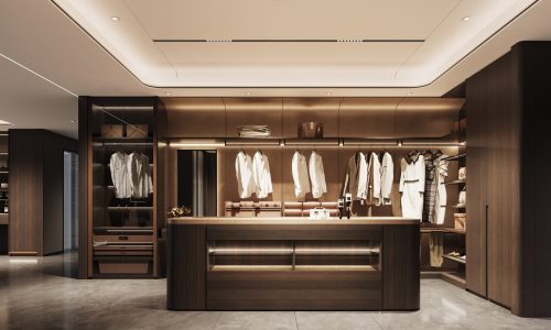 wardrobes Manufacturer 11 Spacious Italian walk-in closet with custom shelving and sophisticated lighting in a luxury showroom.