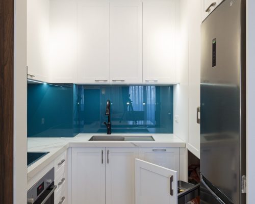 Zemun Stan Whole House custom in Serbia 3 Custom cabinet door with a unique stretching design in the Zemun stan apartment project, highlighting innovative storage solutions.