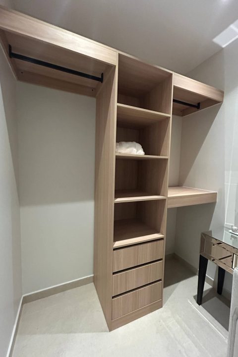 169 Sets Modern Minimalist Apartment Custom Cabinets Project in Dammam 2 Light wood open wardrobe storage cabinet in Dammam apartment with hanging rails, shelves, and drawers.