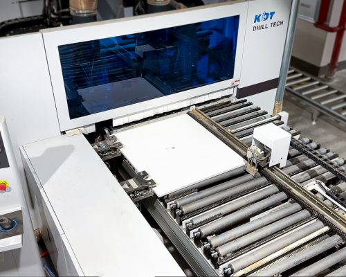 Cabinets 2 A panel with a QR code sticker on the production line at Jilphar Home’s kitchen cabinet factory, about to enter a machine that will scan the QR code and drill precisely at the designated positions based on the information provided for custom made cabinet.