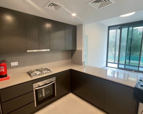 Custom Cabinet Project for Arada Gate In UAE 2 sharjah-gate-custom-kitchen-cabinet-charcoal-grey-beige-countertop-2
