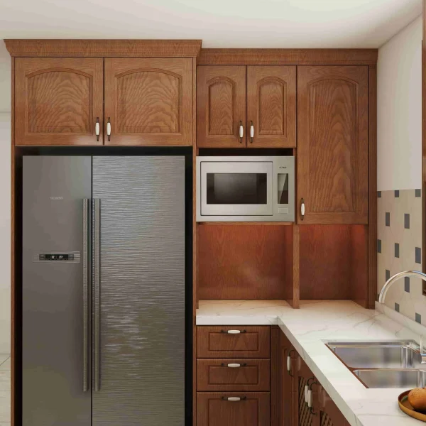 Tradition U-Shaped Walnut Kitchen Cabinets with White Quartz Island 3 A kitchen featuring deep brown wood Corner unit kitchen cabinetry, complete with a stainless steel French-door refrigerator and a built-in microwave oven.
