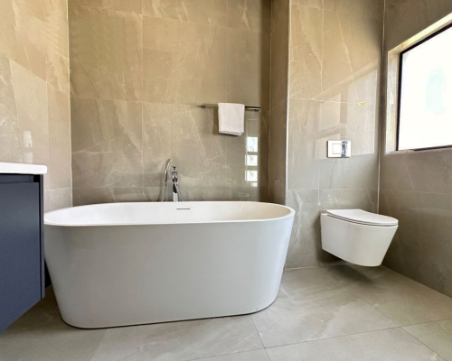 12 Sets Zimbabwe Whole House Custom 1 Zimbabwe Whole house custom bathroom featuring a freestanding bathtub, modern toilet, and sleek cabinetry