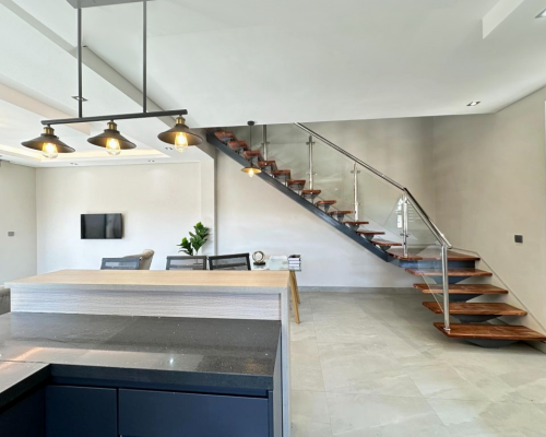 12 Sets Zimbabwe Whole House Custom 9 Zimbabwe whole house custom kitchen interior featuring modern design with bar stools and elegant lighting.